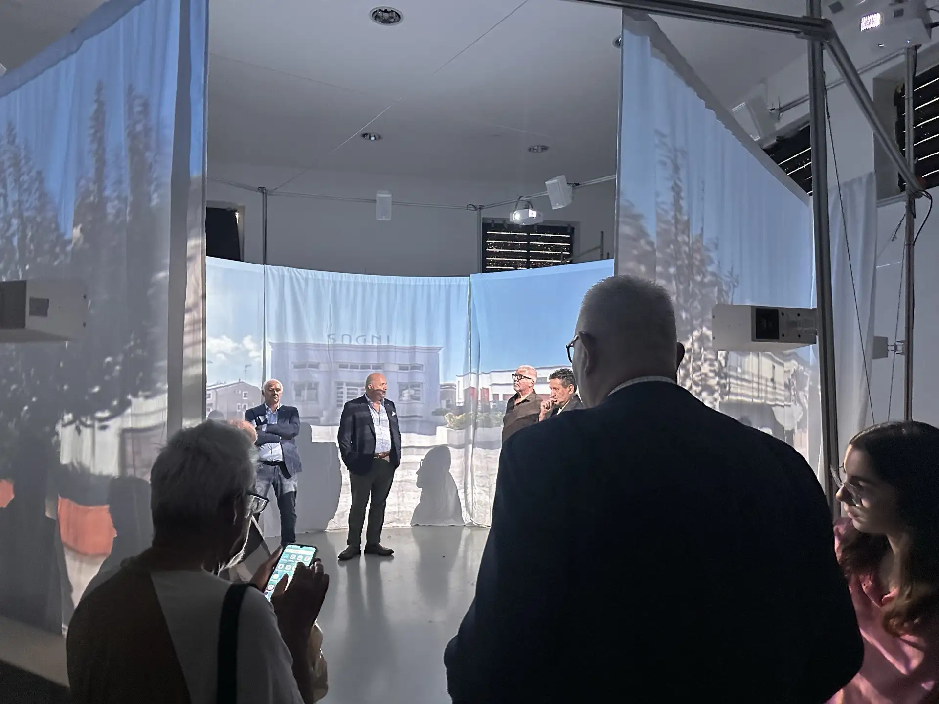 The inauguration of the Agorà Immersive Room showing people experiencing the installation