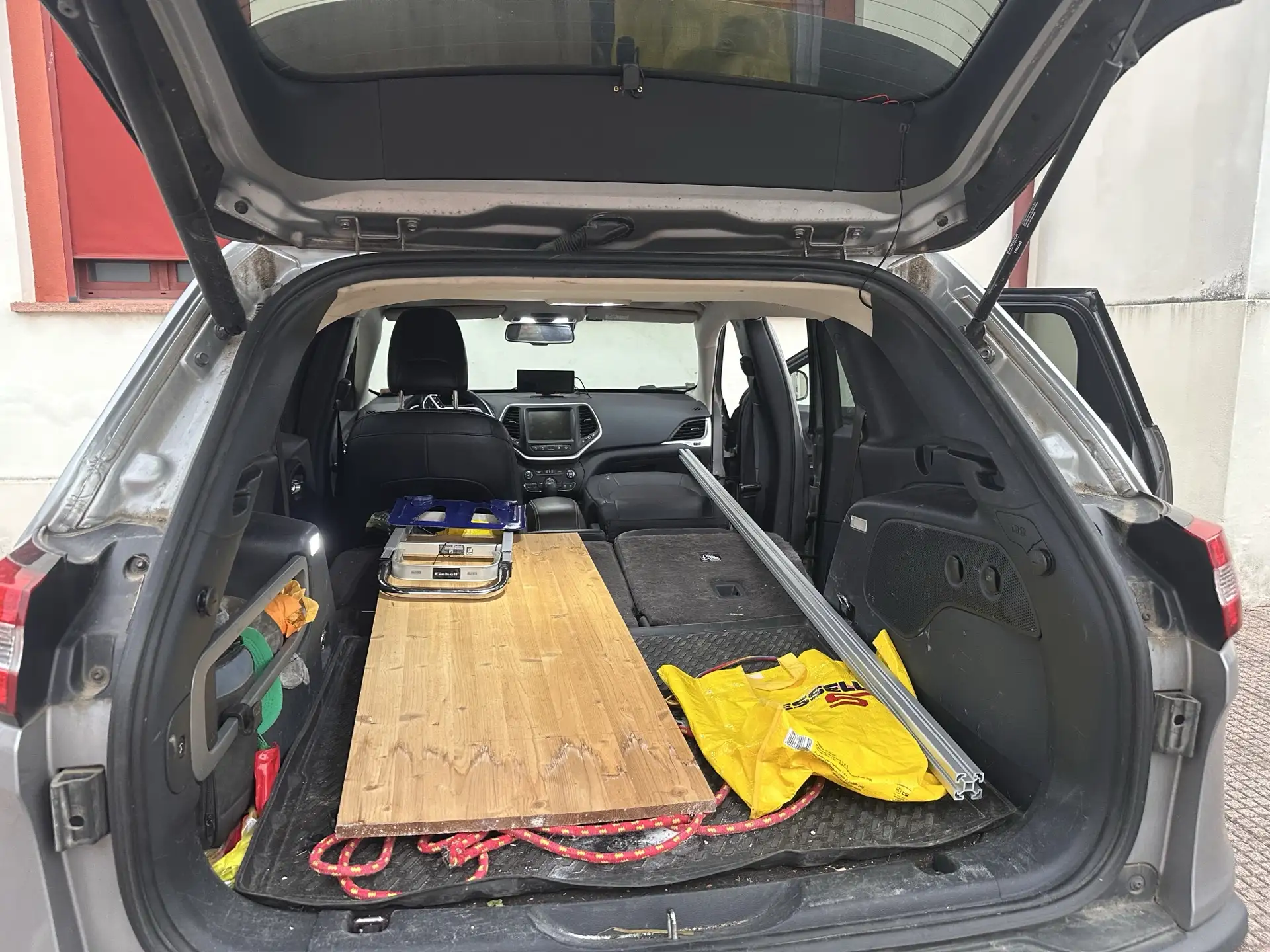 Structure parts loaded into the trunk of a regular car
